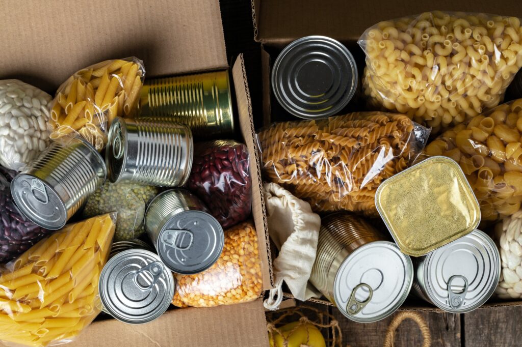 Food donations on the table. Text Donation